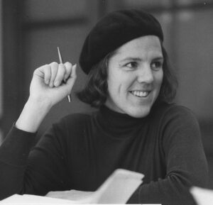 Life Member Rika Ruebsaat smiling in a beret, reflecting on VFSS history 1960–1968.